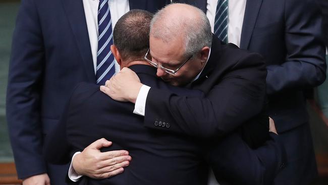 New LNP MP Terry Young is hugged by PM Scott Morrison after delivering his first speech in the House of Representatives at Parliament House in Canberra. Picture: Kym Smith