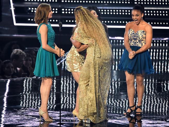 Beyonce embraces US Olympic gymnast Aly Raisman as fellow gymnasts look on after Beyonce was presented with the award for “Best Female Video” at the 2016 MTV Video Music Awards. Picture: AP