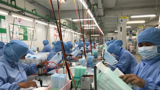 A Thai surgical mask factory, producing 10 million masks a month, has increased working hours to cope with the rising demand. Picture: Jonathan Klein/AFP