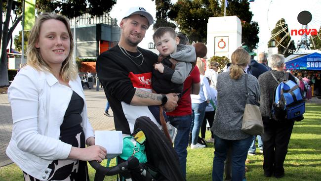 Jessica Edmunds, partner Kieran Tansell and their 2 year old son, Bentley, paid $50 for a car park near the showgrounds. Picture: Dean Martin