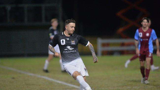 Mackay and Whitsunday Magpies Crusaders United playing against Coomera Colts at Sologinkin Oval for the FFA Cup Round of 32. Liam Shipton sends the ball.