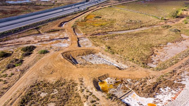 Drone footage of dead and dying mangroves and saltmarsh at St Kilda, where super salty water can be seen in evaporation ponds and some brine is crystallising to white salt. Picture: Alex Mausolf