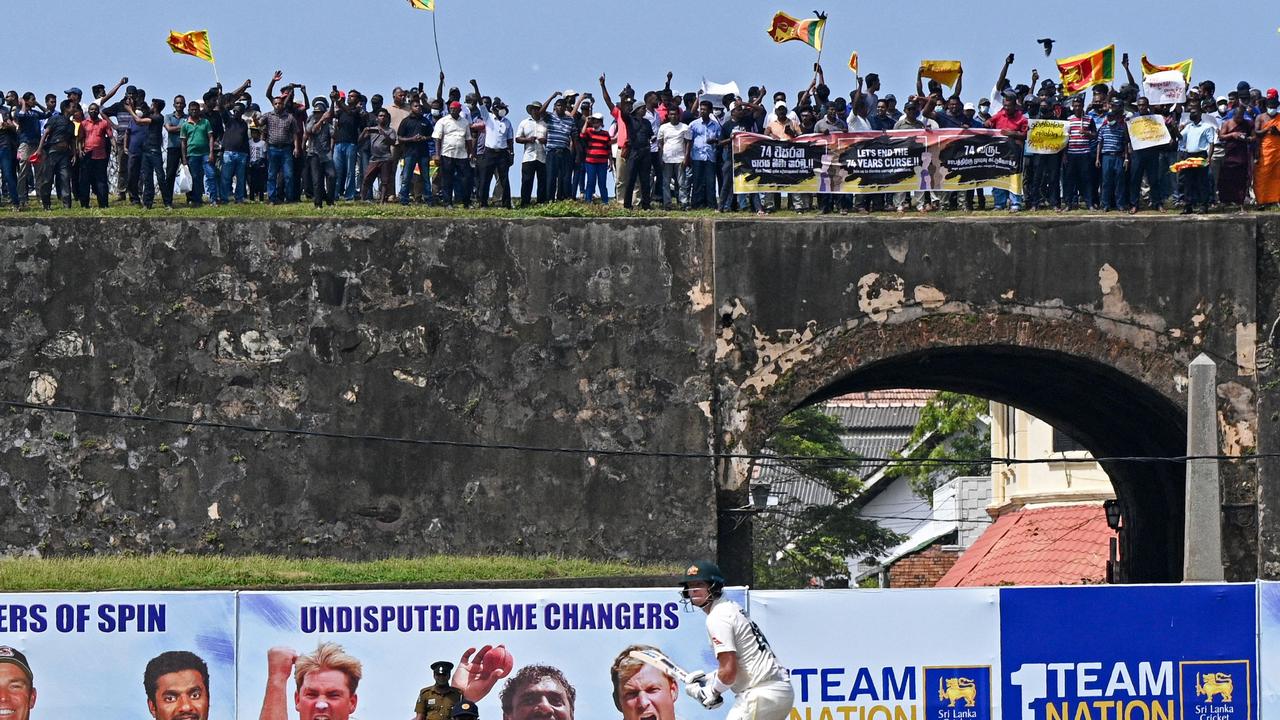 Protestors participate in an anti-government demonstration outside the Galle International Cricket Stadium during the second day of second cricket Test match between Sri Lanka and Australia at the Galle International Cricket Stadium in Galle on July 9, 2022. (Photo by ISHARA S. KODIKARA / AFP)