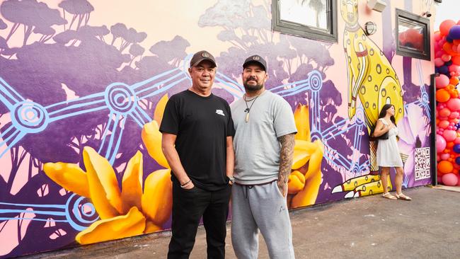 Jason and Trent Lee in front of NT-themed mural unveiled in Los Angeles.