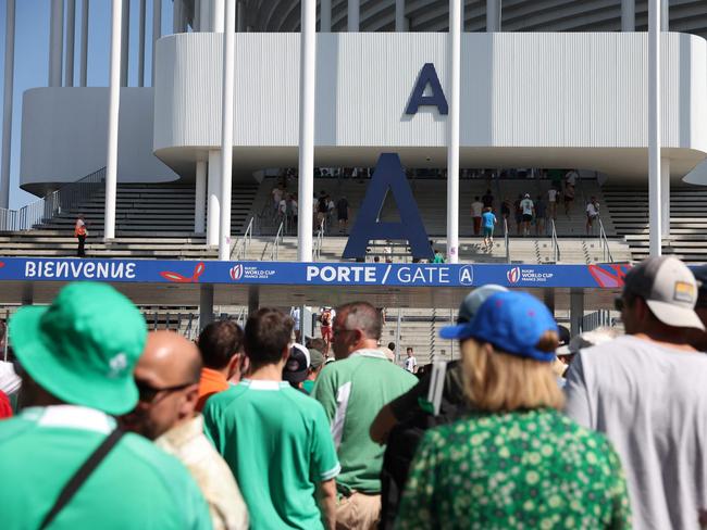 Ireland's supporters queue to enter the stadium ahead of the France 2023 Rugby World Cup Pool B match between Ireland and Romania at Stade de Bordeaux in Bordeaux, south-western France on September 9, 2023. (Photo by ROMAIN PERROCHEAU / AFP)
