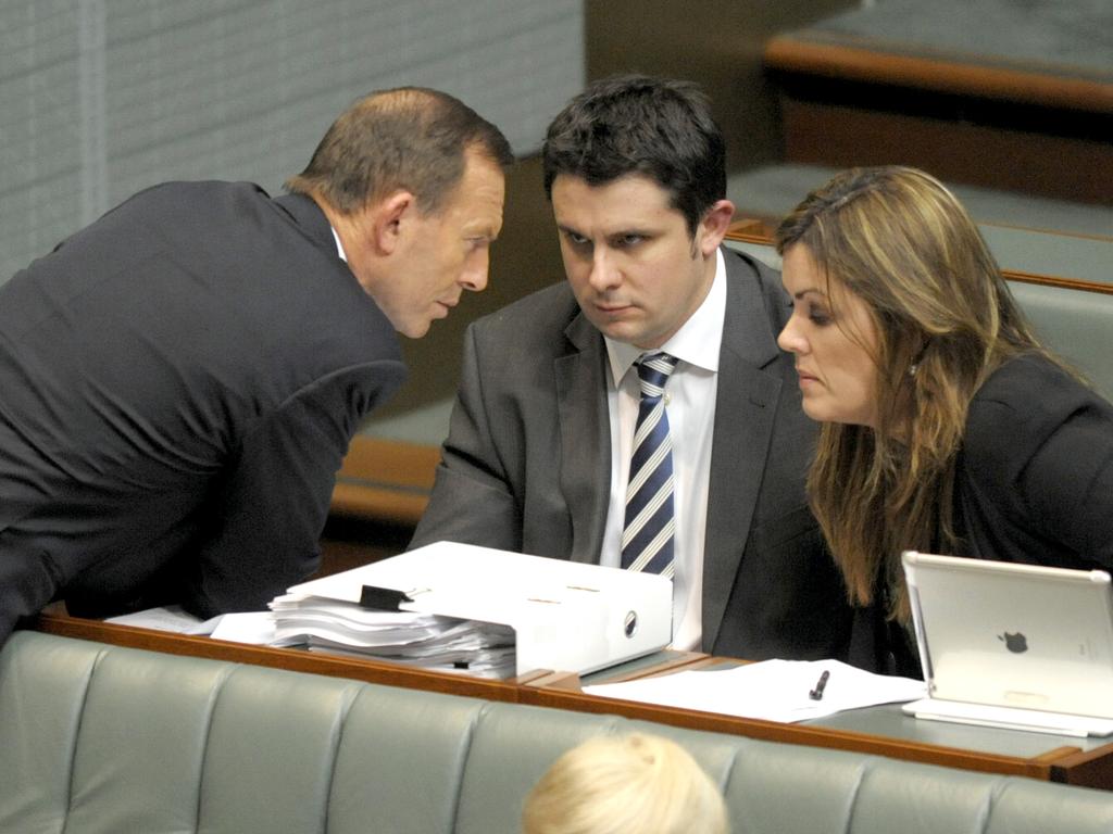 Liberal Party director Andrew Hirst (centre, with Tony Abbott, Peta Credlin in 2013) first sounded the alarm about Dutton’s seat. Picture: AAP Image/Alan Porritt