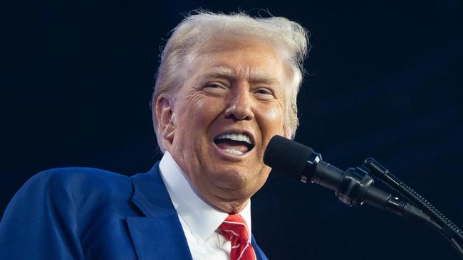 PHOENIX, ARIZONA - DECEMBER 22: U.S. President-elect Donald Trump speaks during Turning Point USA's AmericaFest at the Phoenix Convention Center on December 22, 2024 in Phoenix, Arizona. The annual four day conference geared toward energizing and connecting conservative youth hosts some of the country's leading conservative politicians and activists.   Rebecca Noble/Getty Images/AFP (Photo by Rebecca Noble / GETTY IMAGES NORTH AMERICA / Getty Images via AFP)