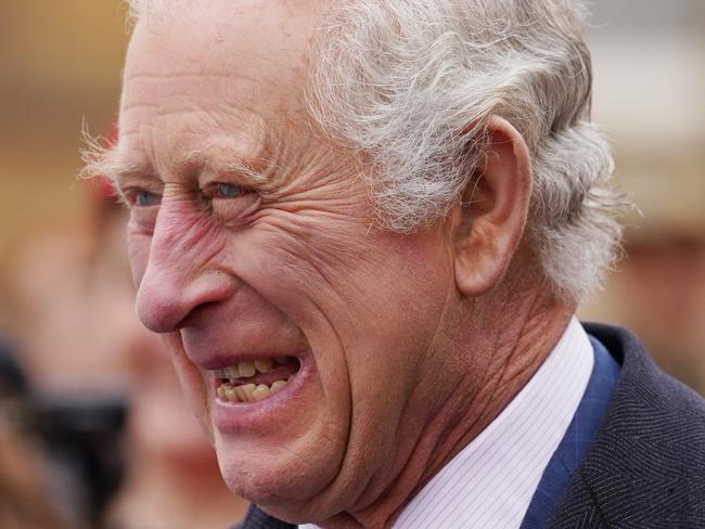 LONDON, ENGLAND - APRIL 28: King Charles III attends the start of the Australian Legacy Torch Relay at Buckingham Palace in London, to mark the beginning of the London-leg of the charity's relay race in celebration of their centenary year, on April 28, 2023 in London, England. The Legacy Centenary Torch Relay is a six-month satellite relay event commemorating  Australian charity Legacy's 100 years of service and acknowledging veterans' families. The torch will travel over 50,000 kilometres through 100 locations, carried by approximately 1,500 Torch Bearers who have a connection to Legacy or the Defence Community. (Photo by Gareth Fuller - WPA Pool/Getty Images)