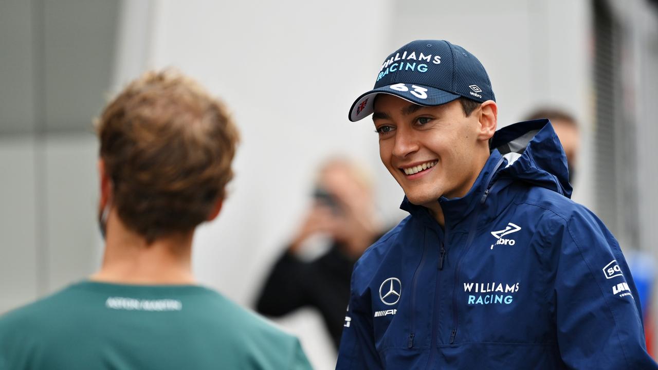 ZANDVOORT, NETHERLANDS - SEPTEMBER 02: George Russell of Great Britain and Williams and Sebastian Vettel of Germany and Aston Martin F1 Team talk in the Paddock during previews ahead of the F1 Grand Prix of The Netherlands at Circuit Zandvoort on September 02, 2021 in Zandvoort, Netherlands. (Photo by Dan Mullan/Getty Images)