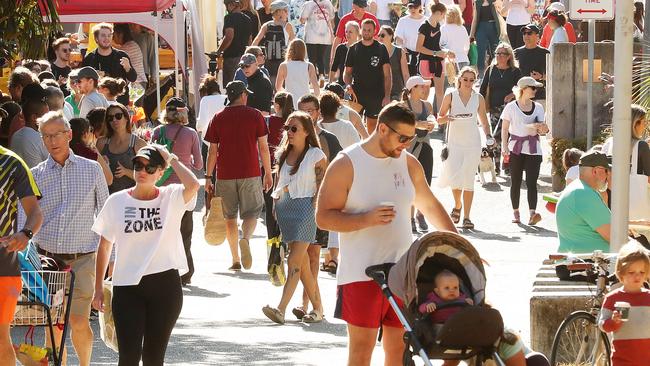 The Brisbane Powerhouse Farmers Markets are a favourite spot for Emily and fiance Ryan Gallagher with son Sampson. Picture: Liam Kidston.