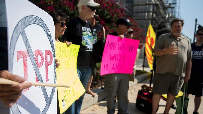 Demonstrators with Trans-Pacific Partnership (TPP) Resistance protest against the TPP outside the Russell Senate Office building on Capitol Hill in Washington, DC last month. (AFP PHOTO/JIM WATSON)