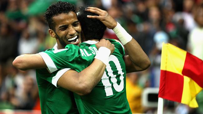 MELBOURNE, AUSTRALIA - JANUARY 14: Al Sahlawi Mohammed of Saudi Arabia celebrates with team-mate Hazazi Naif of Saudi Arabia after scoring a goal during the 2015 Asian Cup match between DPR Korea and Saudi Arabia at AAMI Park on January 14, 2015 in Melbourne, Australia. (Photo by Robert Prezioso/Getty Images)