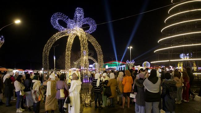 People enjoy New Year's Eve celebrations at Christmas Market in Damascus. Picture: Getty