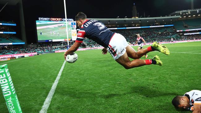 Latrell Mitchell scores a spectacular try during the win over the Tigers. Picture. Phil Hillyard