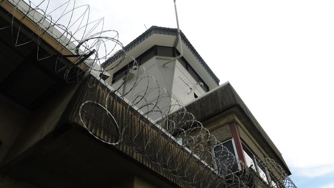 Barbed wire line the top of a fence at the Don Dale Youth Detention Centre. F Block at the Centre caught fire during a riot on Tuesday, November 6, that police struggled to contain. Picture: Keri Megelus