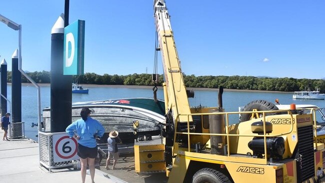 A large boat flipped off its trailer while it was being reversed down a boat ramp at Townsville Recreational Boating Park. Photo: Matt Palmer