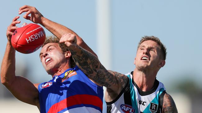 Mitch Wallis contests with Hamish Hartlett in the Power’s win over the Bulldogs. Picture: Matt Turner/AFL Photos via Getty Images.