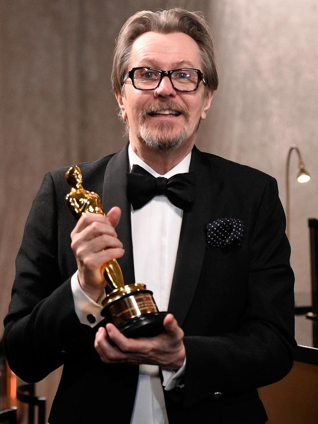 Gary Oldman gets his Oscar engraved at the Governors Ball. Picture: Kevork Djansezian/Getty Images/AFP