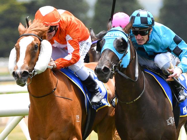 Jockey Ben Melham rides Euphoric Summer to victory from jockey Mark Zahra riding Rathlin in race 4, the Magic Millions Clockwise, during the Ballarat Cup Day at Ballarat Racecourse in Ballarat, Saturday, November 23, 2019. (AAP Image/Vince Caligiuri) NO ARCHIVING, EDITORIAL USE ONLY