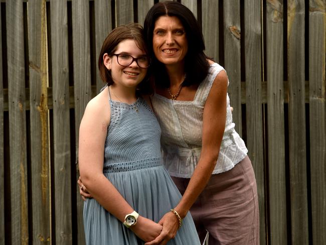 Kylie Duggan, with daughter Addison, 11,  is preparing to have surgery for a cochlear implant that will change the way she lives.Picture: Evan Morgan