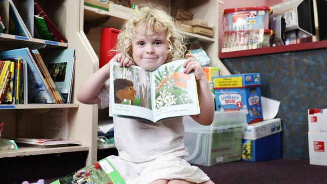 Ariya Buckley, 3, of Bentley Park, casts her inquisitive eyes over some books at Harleys Educational Superstore in Manunda. She will attend Child's World daycare at Bentley Park while her 7-year-old brother Darius will attend St Therese's School. Picture: Brendan Radke