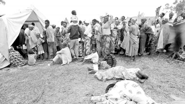 Over 1 million Rwandan refugees diseased &amp; exhausted line up outside CARE Australia tent in Katale camp, Goma, Zaire where they hope to be seen by Aust doctors. Picture Chris Mangan. 20 August 1994.