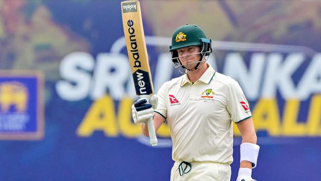 Steve Smith celebrates after scoring his ten thousandth run during the first day of the first Test cricket match between Sri Lanka and Australia at the Galle International Cricket Stadium. Picture: AFP