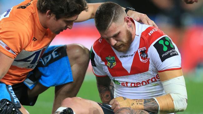 Josh Dugan of the Dragons suffers an injury during the St George Illawarra Dragons v Wests Tigers round 26 NRL game at ANZ Stadium, Sydney Olympic Park. pic Mark Evans