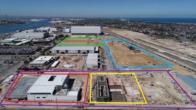 The Osborne shipyard under construction. Purple – Phase 1 works. Red: The building where Lockheed Martin will construct the combat system. Yellow: The Land Based Test Facility. Blue – The main production halls, where work is underway to build the foundations. Green – Future site of the Main Assembly Hall, where the submarines will be assembled. The large hall behind the green square is the Osborn South Shipyard and site of the Hunter Class Frigates and Offshore Patrol Vessels. To the left of the green square is the ASC maintenance yard for the Collins Class subs.