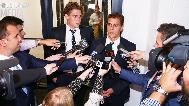 Charlie and Ed Curnow speak to the media.