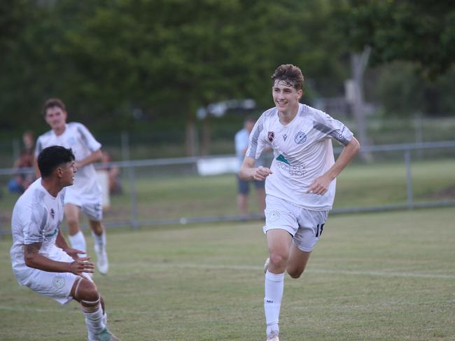 Cooper Kennedy celebrates goal with Marlin Coast coach Crios O'Hare and teammates. Marlin Coast Rangers v Edge Hill United Tigers at Pennell Field-Trinity Beach. FQPL Far North &amp; Gulf 2024. Photo: Gyan-Reece Rocha