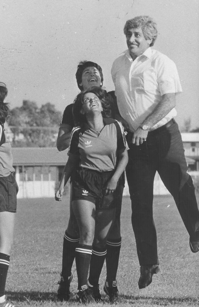 As Minister for Youth, Sport and Recreation, competing in a soccer match against junior soccer players (from left) Graca de Castro, Anna Almerda and Samantha Drew.