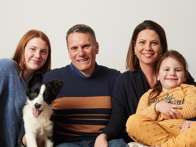 Hayley, 15, Gary and Nicky Edwards with Madison, 5 pose for a picture with their puppy Jodie in their family home in Kensinton Gardens, after moving to Adelaide from South Africa over 10 years ago, Thursday, Aug. 2, 2018. Picture: MATT LOXTON