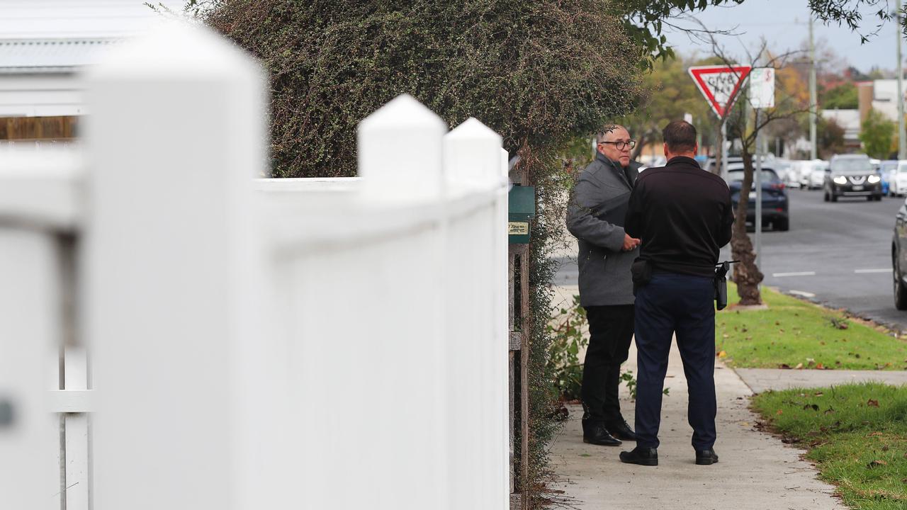 Geelong CIU Detective Senior Sergeant Mark Guthrie (left) investigates the scene on Munday Street, South Geelong on Wednesday morning. A 73-year-old was walking home along Mundy St on Tuesday evening around 6pm she got to the Bellerine St corner, a man attacked her from behind and stabbed her multiple times. Picture: Alan Barber