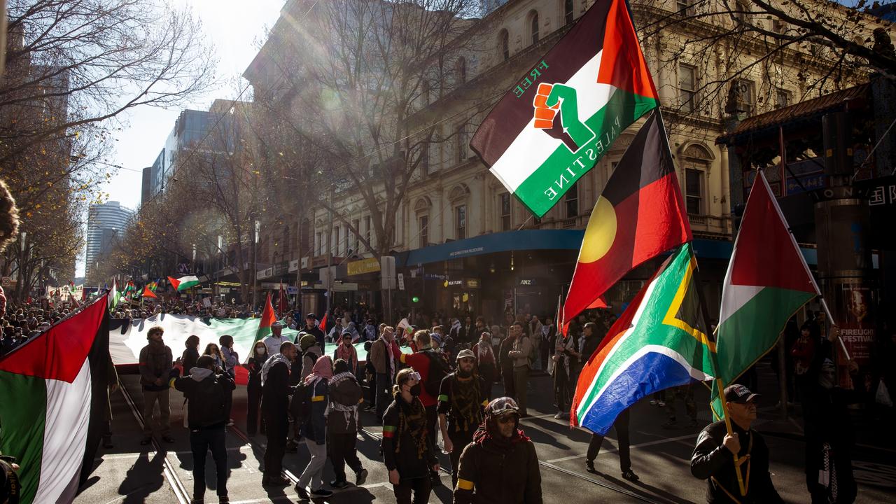 Pro-Palestinian supporters march along Swanston St in Melbourne. Picture: NewsWire / Tamati Smith