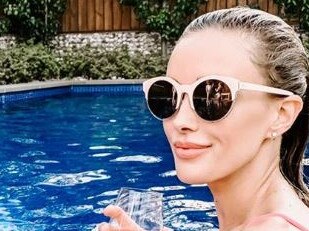 Bec Judd relaxing in a pool on last day of Summer