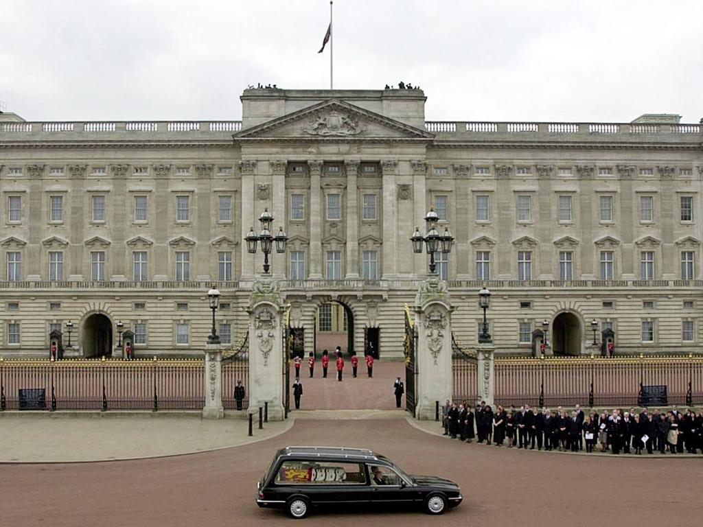 The hearse carrying the coffin of Queen Elizabeth, The Queen Mother, passing Buckingham Palace following her funeral at Westminster Abbey. Picture: AFP