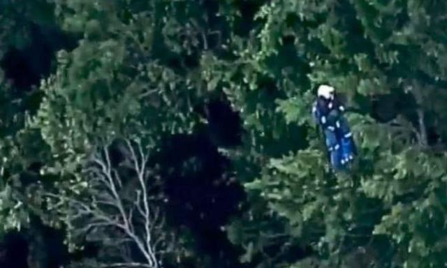 A rescuer gets winched at the scene. Picture: Channel 9Source:Channel 9
