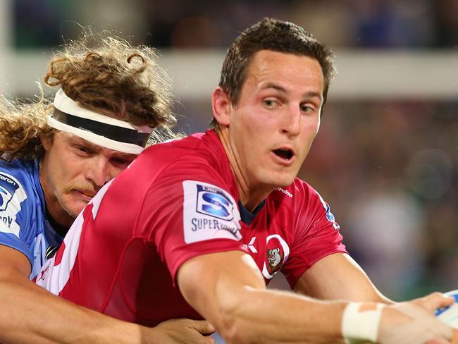 PERTH, AUSTRALIA - JULY 05: Mike Harris of the Reds looks to offload the ball during the round 18 Super Rugby match between the Western Force and the Queensland Reds at nib Stadium on July 5, 2014 in Perth, Australia. (Photo by Paul Kane/Getty Images)