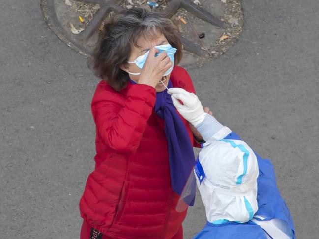 A resident undergoes a nucleic acid test for Covid-19 in Jilin in China's northeastern Jilin province. Picture: AFP