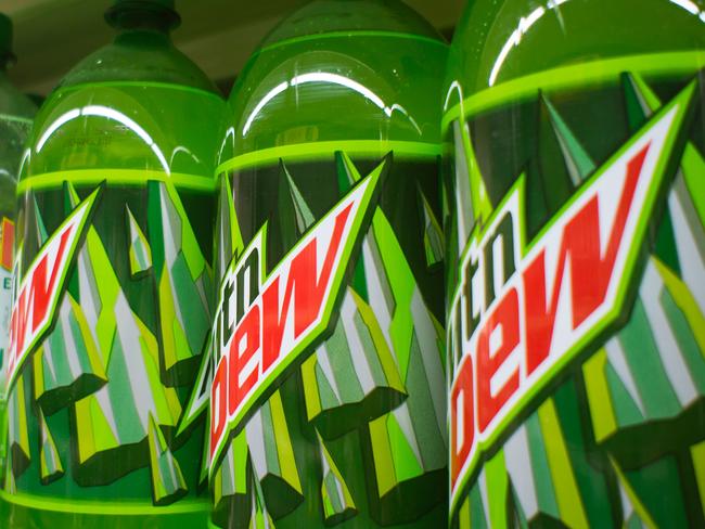 C390MG Bottles of Mountain Dew and other brands of soda are seen on a supermarket shelf in New York