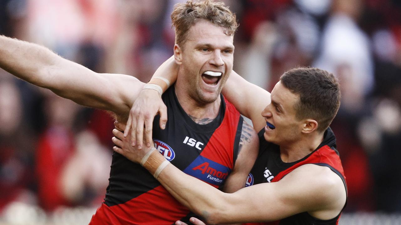 Jake Stringer of the Bombers (left) celebrates a goal during the Round 16 AFL match between the Essendon Bombers and the Sydney Swans at the MCG in Melbourne, Saturday, July 6, 2019. (AAP Image/Daniel Pockett) NO ARCHIVING, EDITORIAL USE ONLY