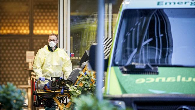 Ambulance officers at the Pullman Hotel. It’s not clear why the ambulance was called to the hotel. Photo: Mike Burton.