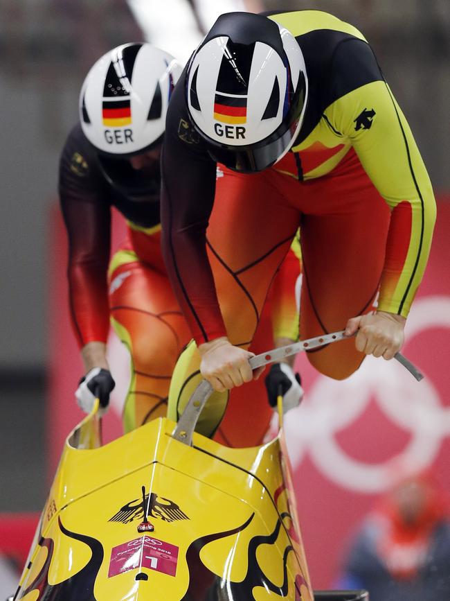 Driver Nico Walther and Christian Poser of Germany start their run in the two-man bobsled at the Winter Olympics. Picture: AP Photo/Andy Wong