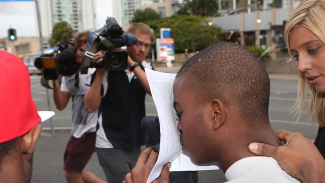 Jean-Adelphe Lasm confronted by the media after he was bailed for bashing a Gold Coast bus driver.