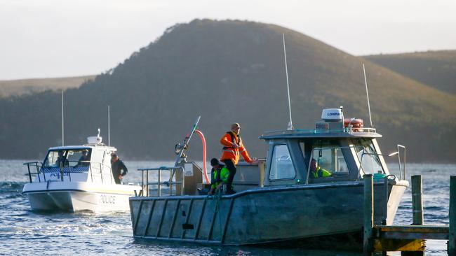 The rescue operation winds up for the day on September 22, 2020 after about 270 pilot whales became stranded at Macquarie Heads at Strahan. Picture: PATRICK GEE