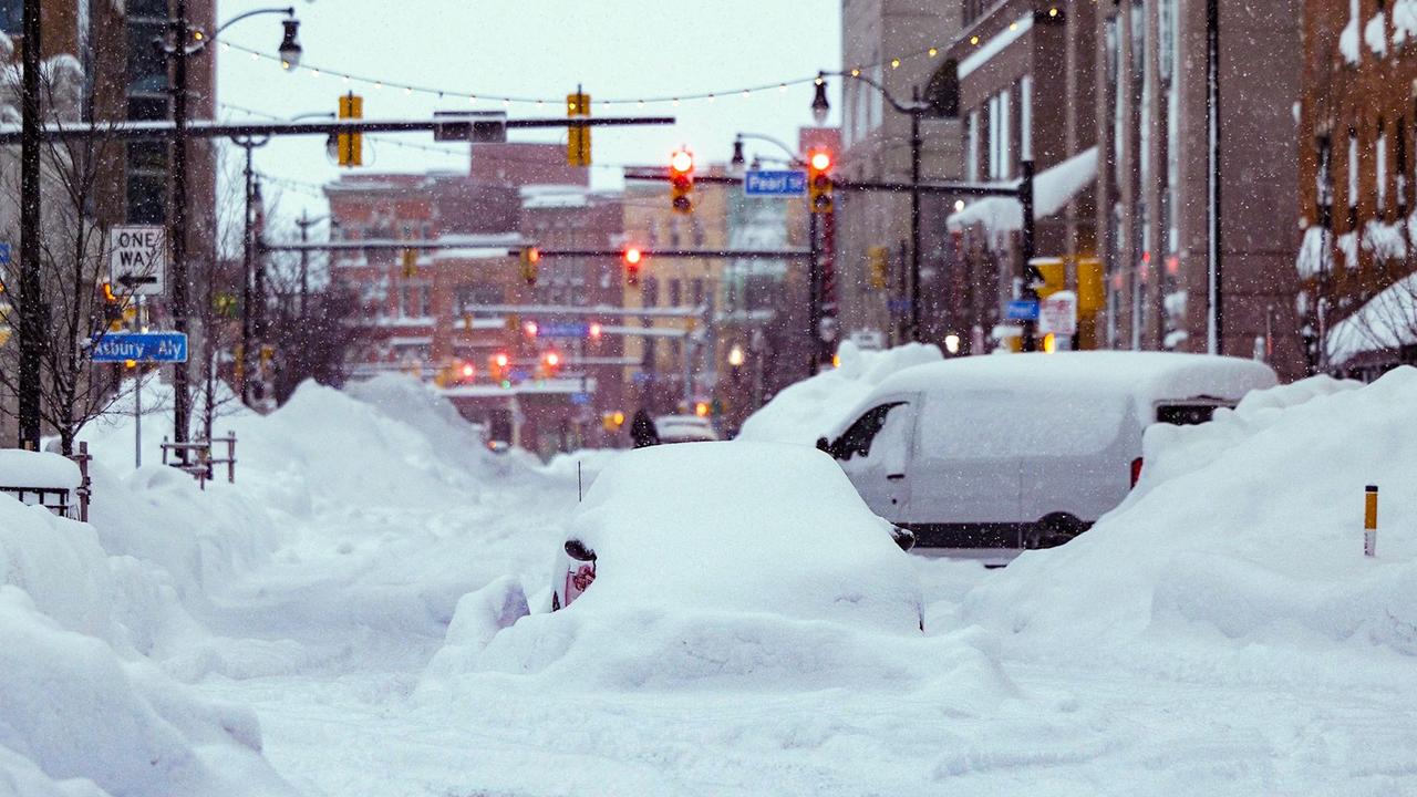 Vehicles trapped under heavy snow in the streets of downtown Buffalo, New York, on December 26Picture: AFP PHOTO / THE OFFICE OF GOVERNOR KATHY HOCHUL