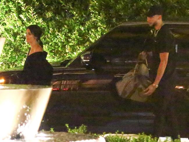 Still dating? Kendall Jenner and Ben Simmons, carrying an overnight bag, at the Waldorf Astoria in Beverly Hills last week Picture: Backgrid