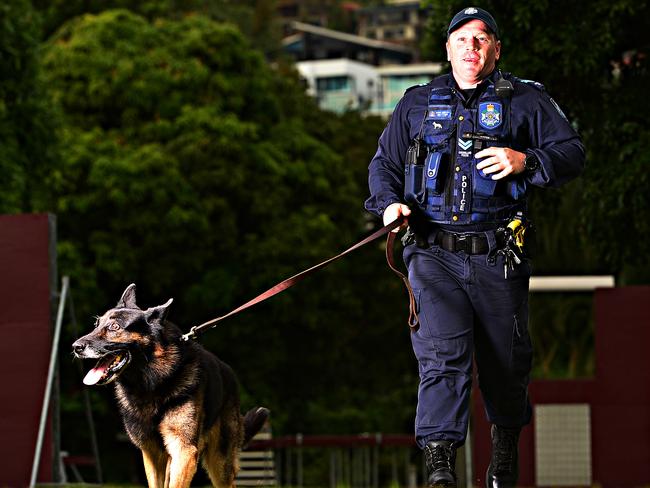 The Townsville Police are holding an open day this Sunday.  Senior Constable Brett Tome from the Townsville Dog squad with 9 year old Khan.  Picture: Zak Simmonds