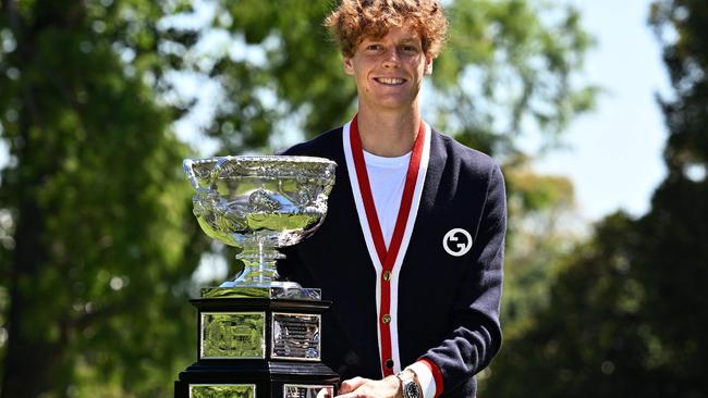 Italy's Jannik Sinner celebrates with the Australian Open trophy in Melbourne. Picture: Anthony Wallace / AFP